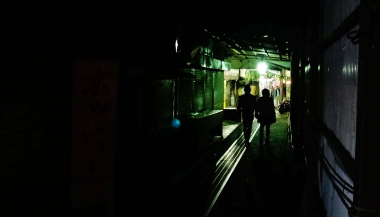 9 couple walking in dark tunnel